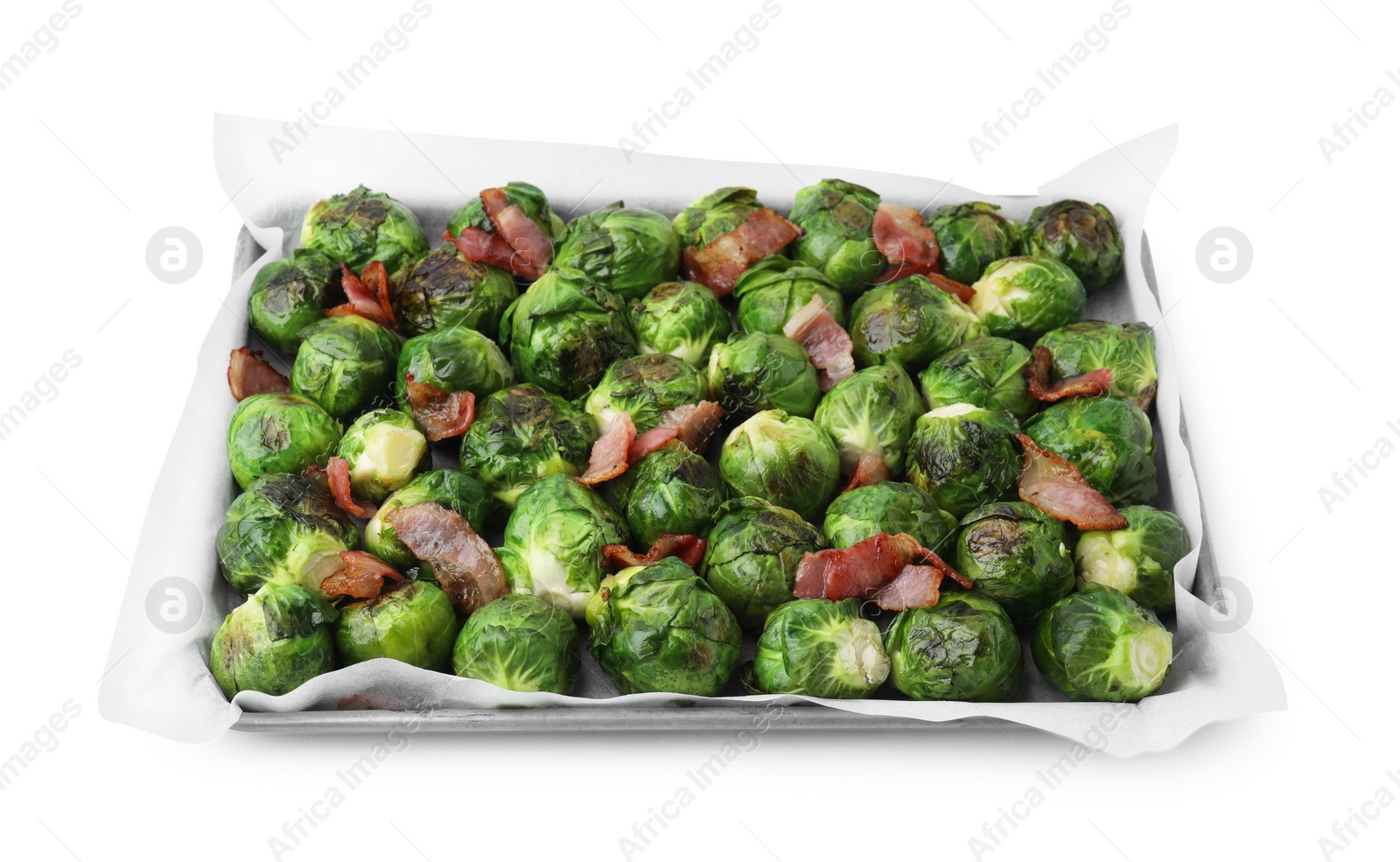 Photo of Delicious roasted Brussels sprouts and bacon in baking dish isolated on white