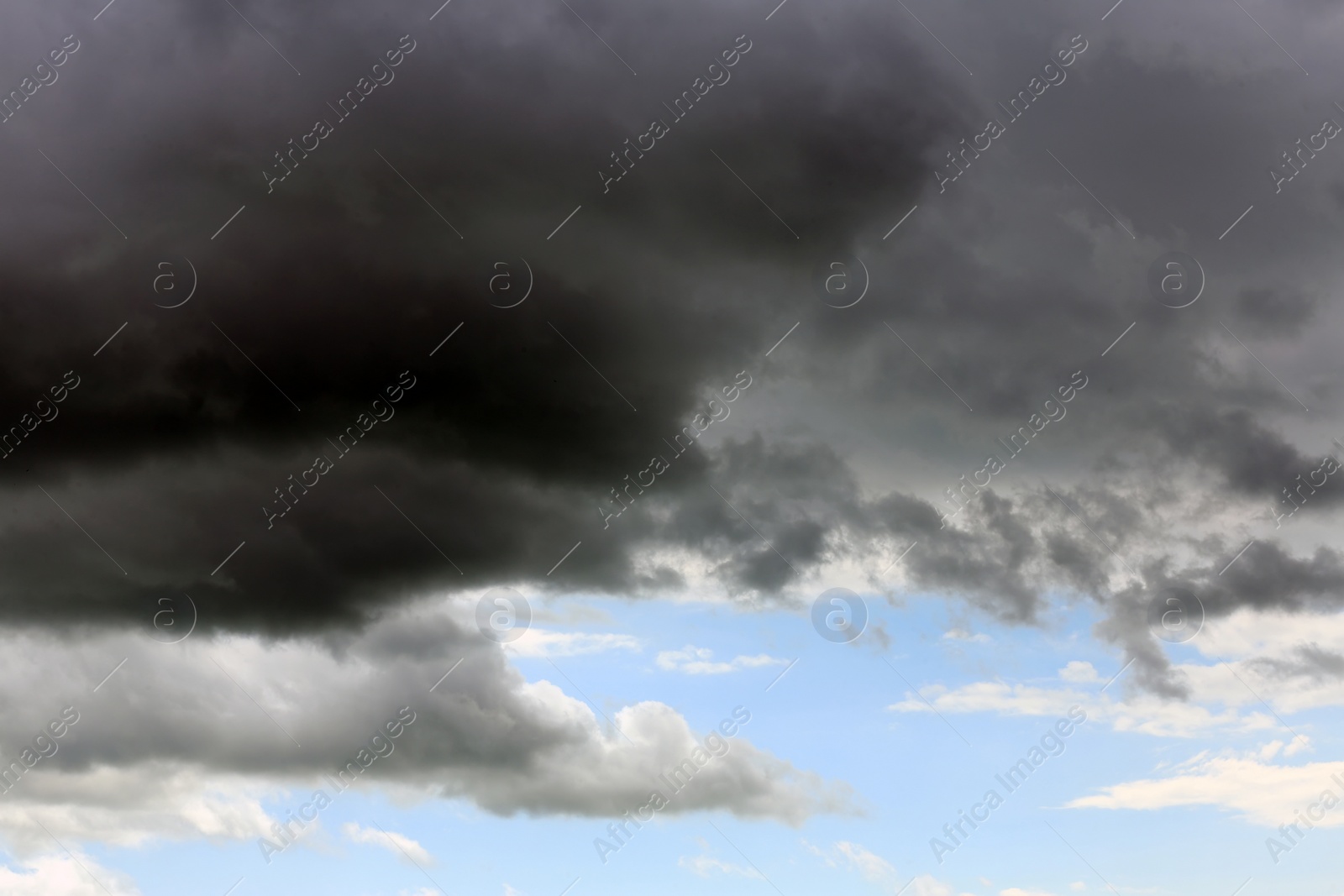 Photo of Sky with heavy rainy clouds on grey day