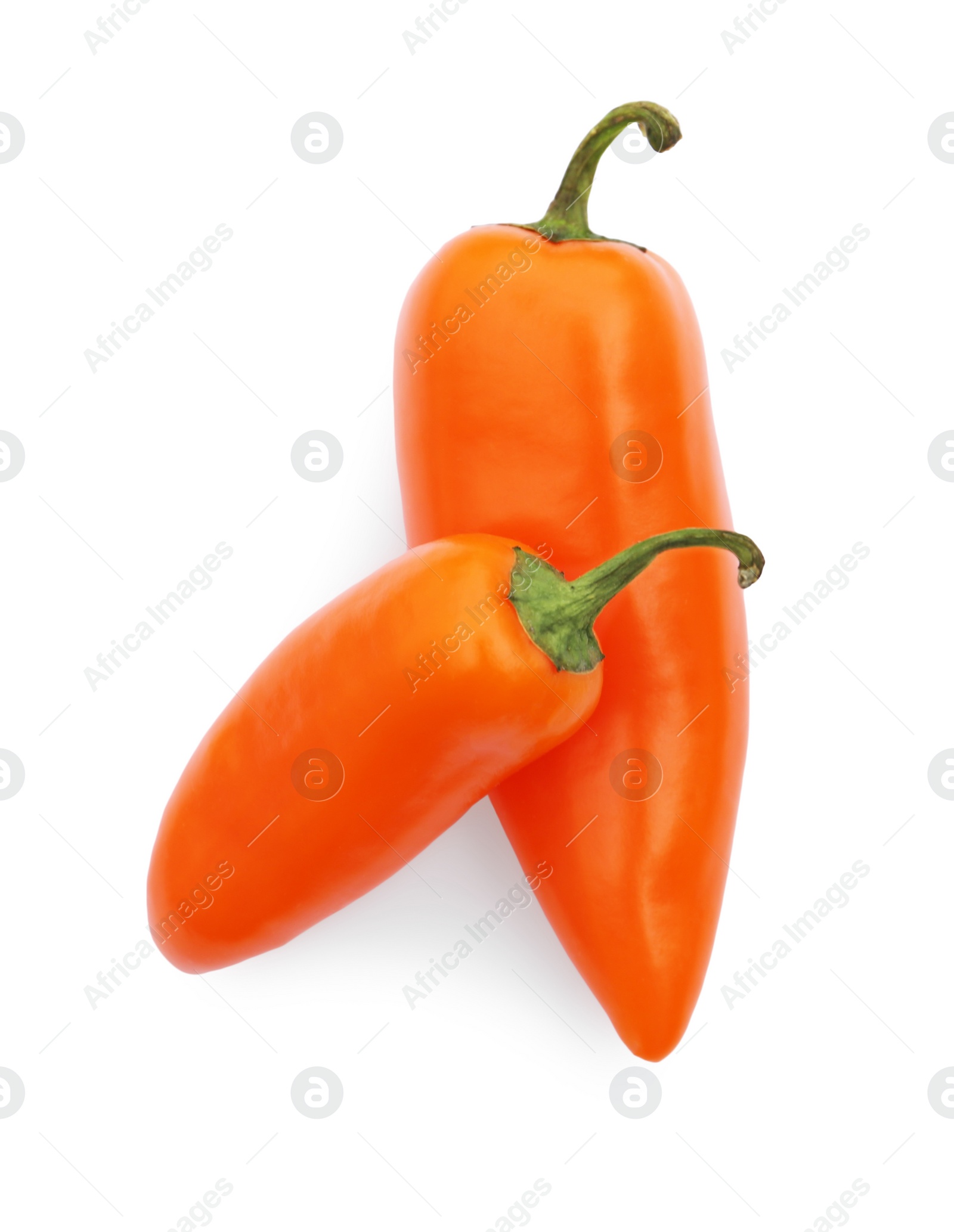 Photo of Fresh raw orange hot chili peppers isolated on white, top view