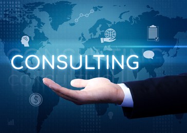 Image of Man showing virtual image of word CONSULTING, closeup