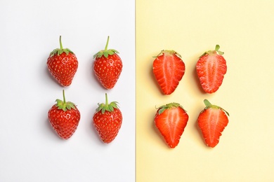 Photo of Flat lay composition with strawberries on color background