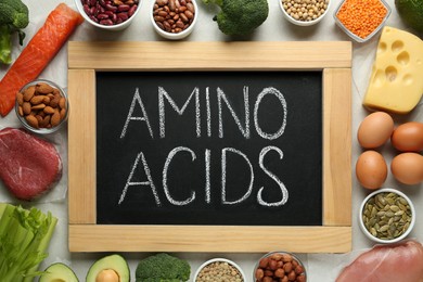 Photo of Flat lay composition with products rich in amino acids on light grey table