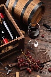 Photo of Winemaking. Composition with tasty wine and barrel on wooden table, above view