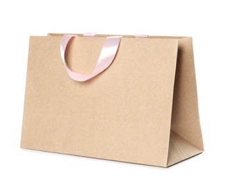 Photo of Paper shopping bag isolated on white. Mock up for design
