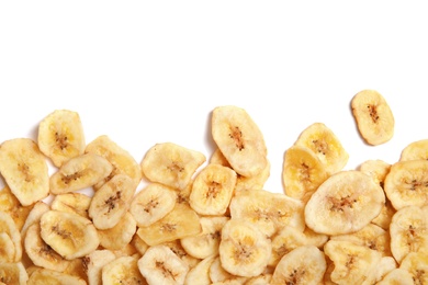 Tasty banana slices on white background, top view with space for text. Dried fruit as healthy snack