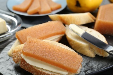 Photo of Tasty sandwiches with quince paste on table, closeup