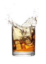 Photo of Whiskey splashing out of glass on white background