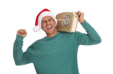 Photo of Emotional man with vintage radio on white background. Christmas music