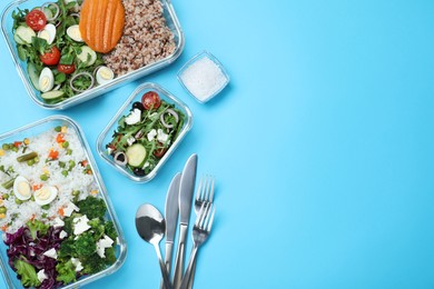 Photo of Set of glass containers with fresh food and cutlery on light blue background, flat lay. Space for text