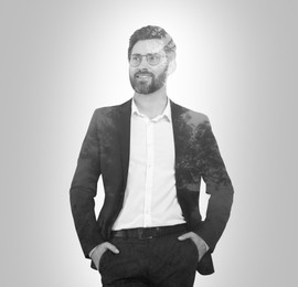 Image of Double exposure of businessman and trees on grey background, black and white effect