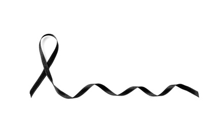 Photo of Black ribbon on white background. Funeral accessory