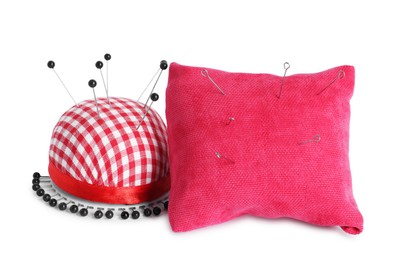 Photo of Pincushions, sewing needles and pins isolated on white