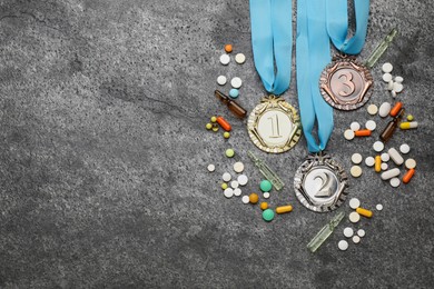 Photo of Flat lay composition with drugs on grey table, space for text. Doping control