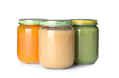 Photo of Jars with different baby food on white background