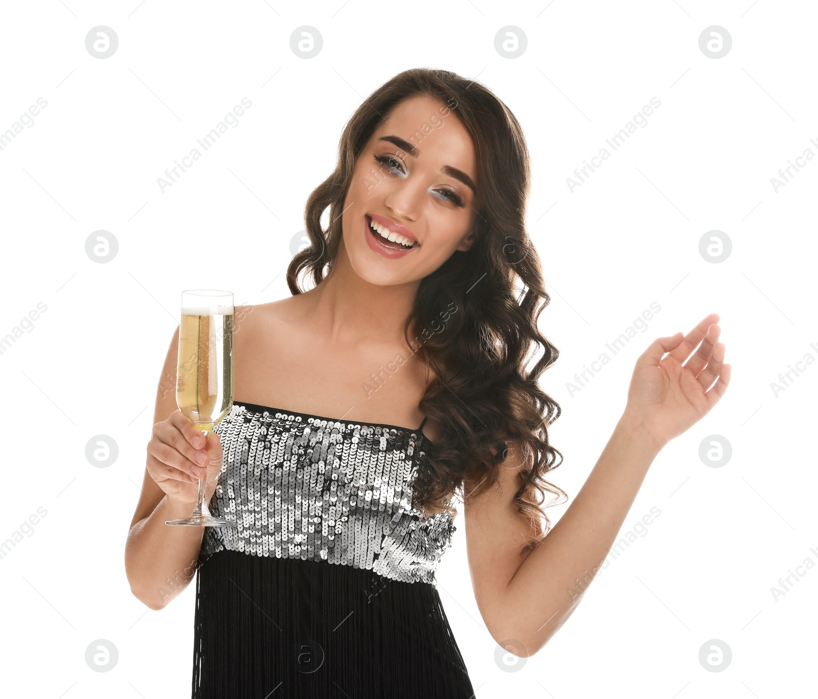 Photo of Beautiful young woman wearing elegant dress with glass of champagne on white background. Christmas party