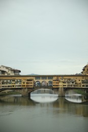 Photo of Florence, Italy - February 8, 2024: Picturesque view of city with beautiful buildings and river