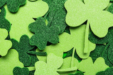 Photo of Clover leaves as background, top view. St. Patrick's Day celebration