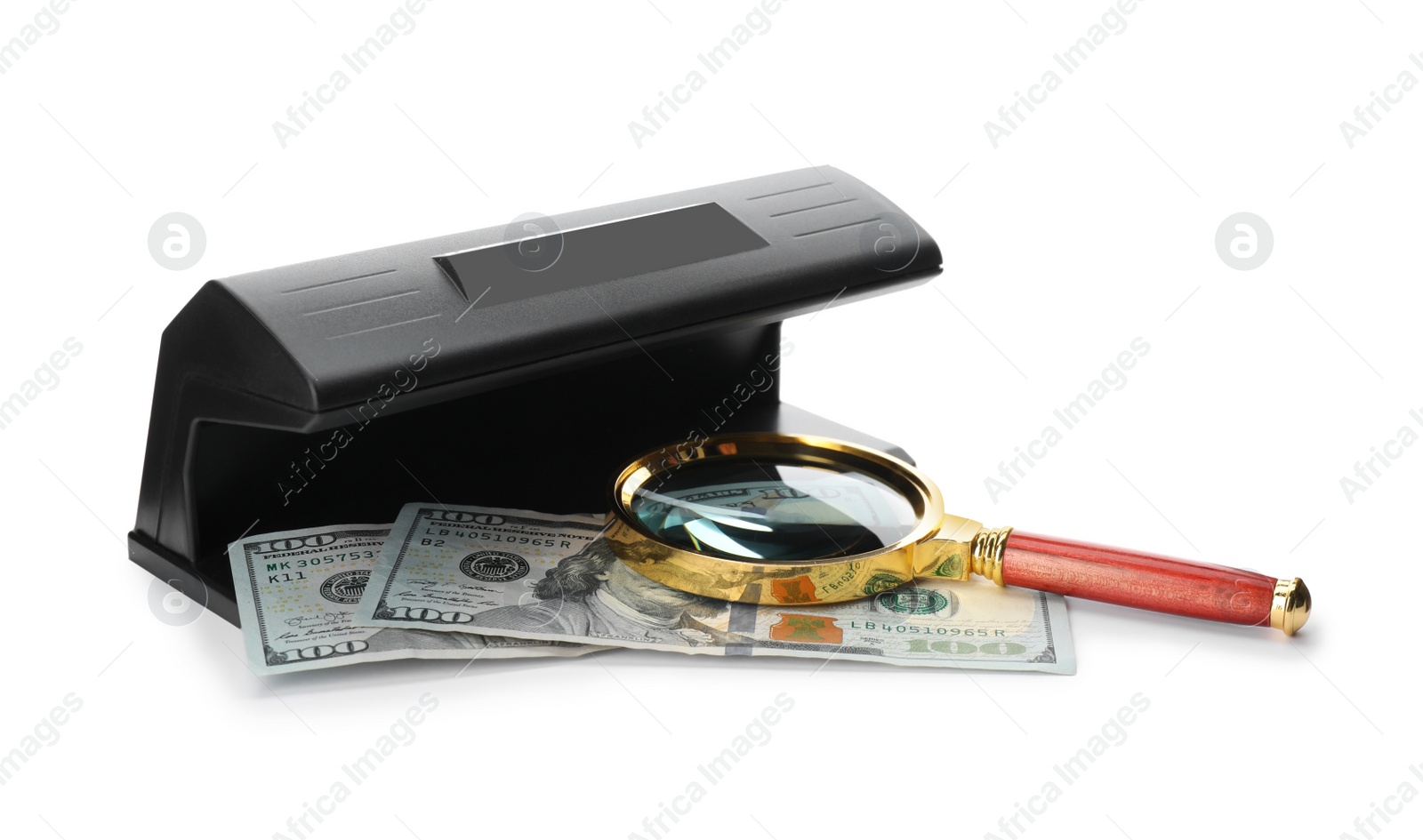 Photo of Modern currency detector with dollar banknotes and magnifying glass on white background. Money examination device