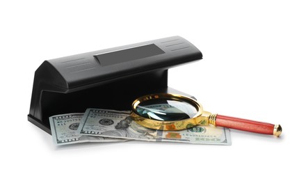Photo of Modern currency detector with dollar banknotes and magnifying glass on white background. Money examination device
