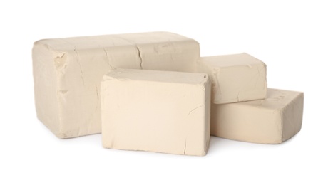 Blocks of compressed yeast on white background