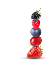 Stack of different fresh tasty berries on white background