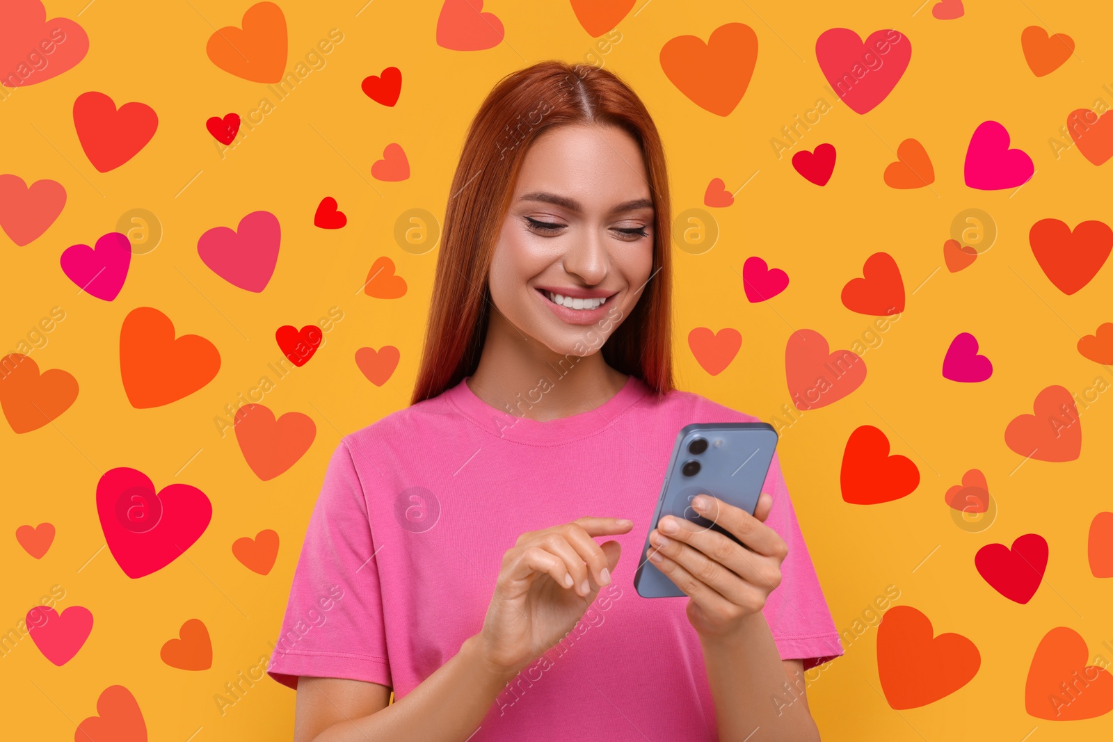 Image of Long distance love. Woman chatting with sweetheart via smartphone on golden background. Hearts around her