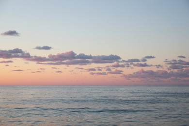 Photo of Picturesque view of sea under beautiful sky at sunset