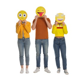 Photo of People covering faces with emoticons on white background