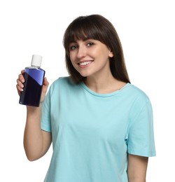 Photo of Young woman with mouthwash on white background