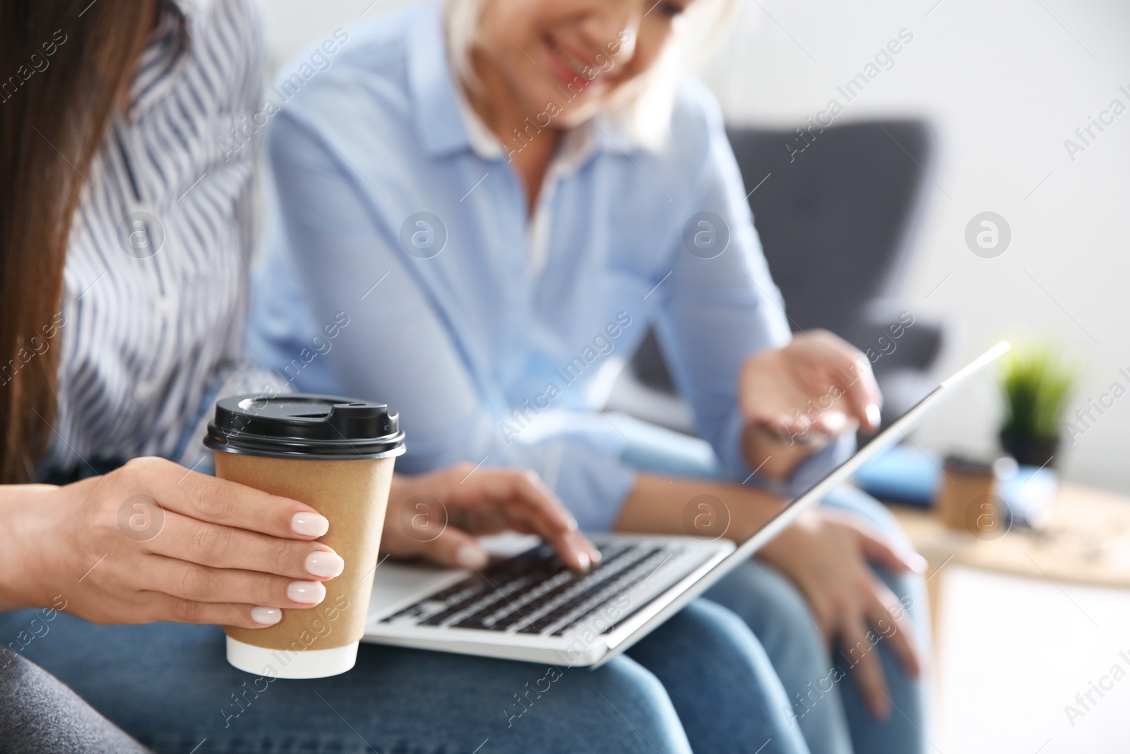Photo of Business people working on laptop in office, closeup. Professional communication