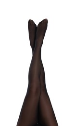 Woman with beautiful long legs wearing black tights on white background, closeup