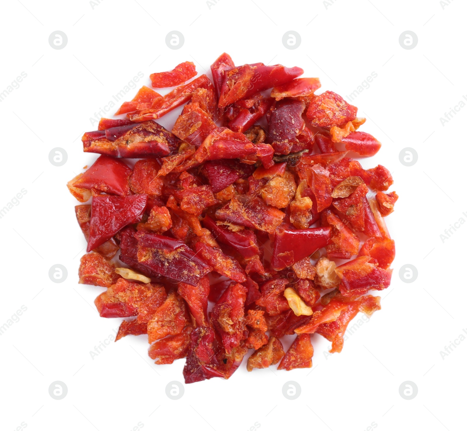 Photo of Aromatic spice. Red chili pepper flakes isolated on white, top view