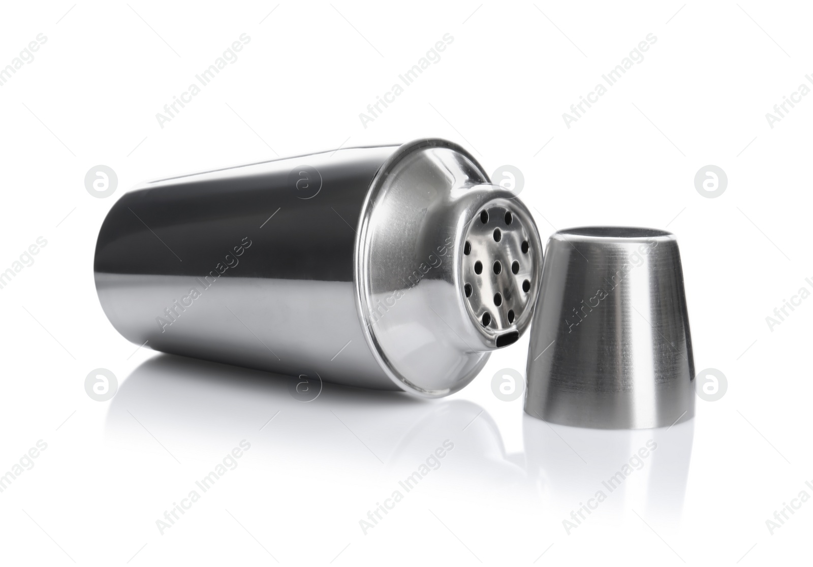 Photo of Metal cocktail shaker and cup isolated on white