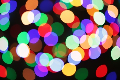 Photo of Beautiful colorful lights on dark background. Bokeh effect