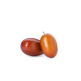 Two ripe red dates on white background