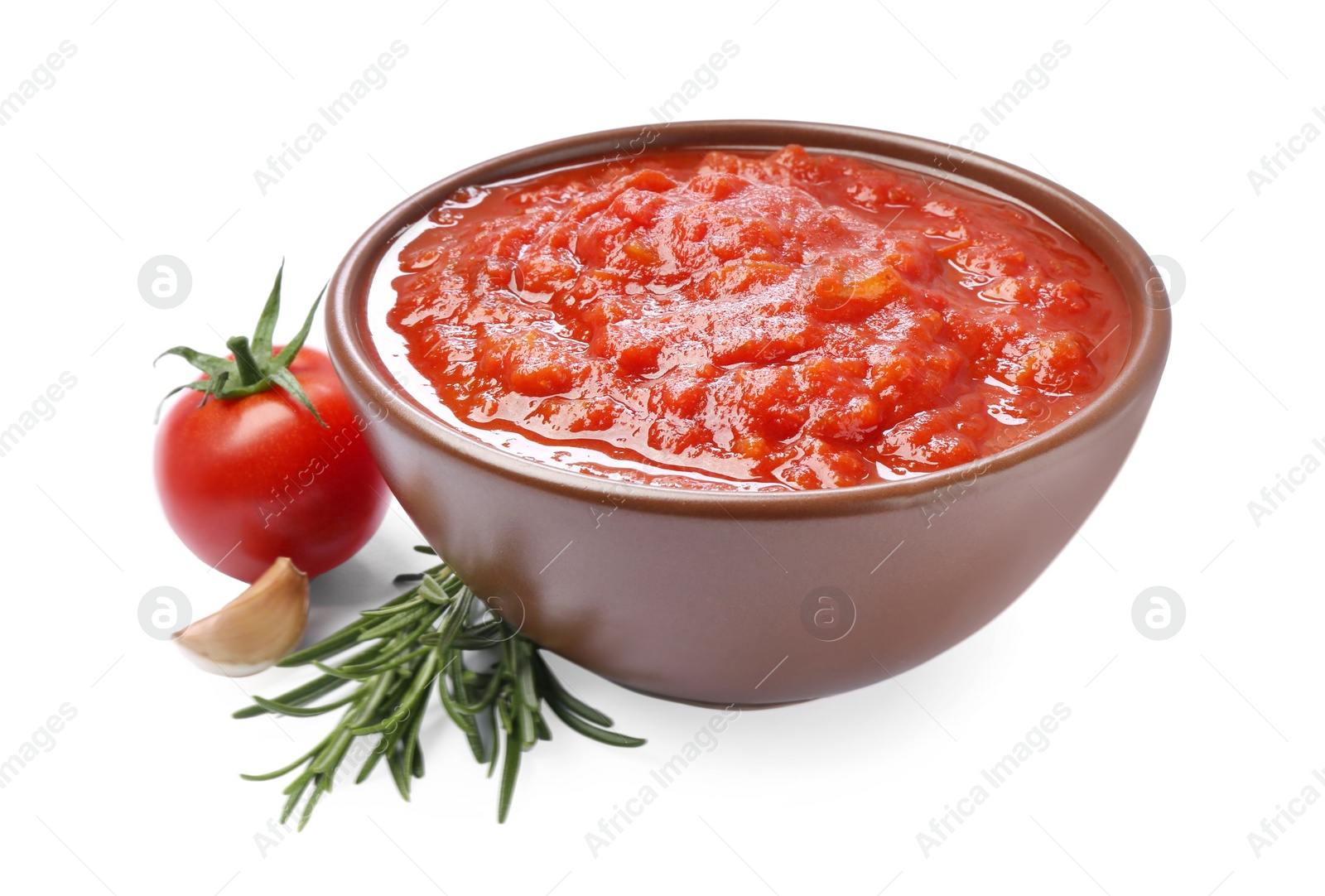 Photo of Homemade tomato sauce in bowl and fresh ingredients isolated on white