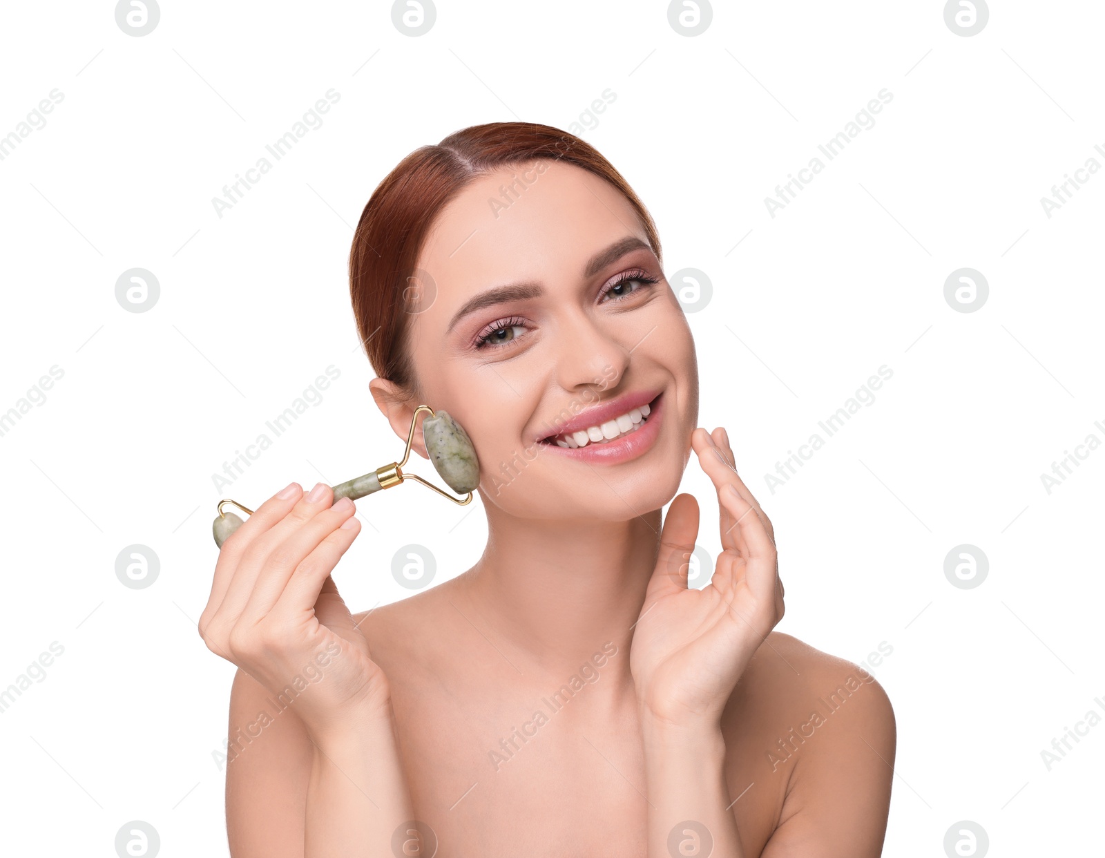 Photo of Young woman massaging her face with jade roller on white background