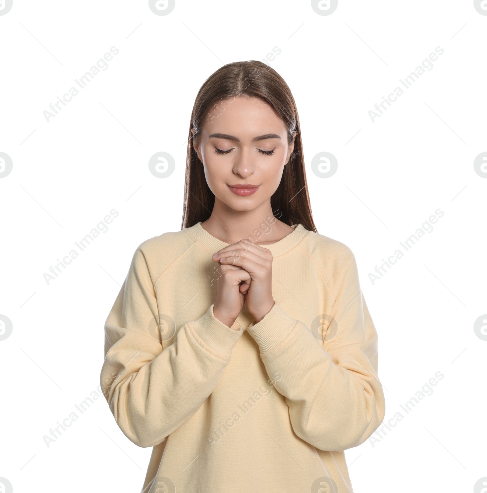 Photo of Woman with clasped hands praying on white background