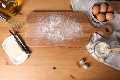 Photo of Many different ingredients for dough on wooden table, flat lay