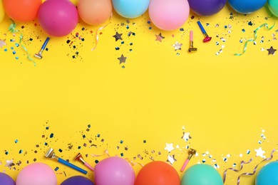 Photo of Flat lay composition with birthday decor on yellow background, space for text