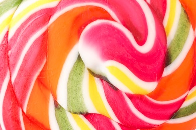 Photo of Tasty colorful fruit flavored candy as background, closeup