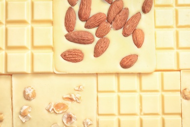 Photo of Different delicious white chocolate bars as background