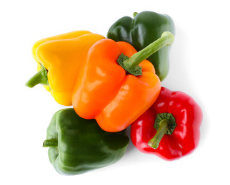 Photo of Ripe colorful bell peppers isolated on white, top view