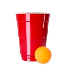 Photo of Red plastic cup and ball for beer pong on white background