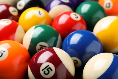 Many colorful billiard balls as background, closeup
