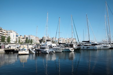 Picturesque view of port with modern boats on sunny day