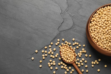 Photo of Soy on black table, flat lay. Space for text