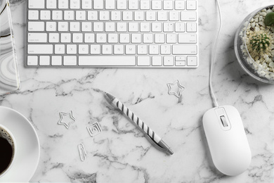 Photo of Flat lay composition with mouse and keyboard on white marble table