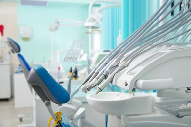 Photo of Set of professional instruments in dentist's office