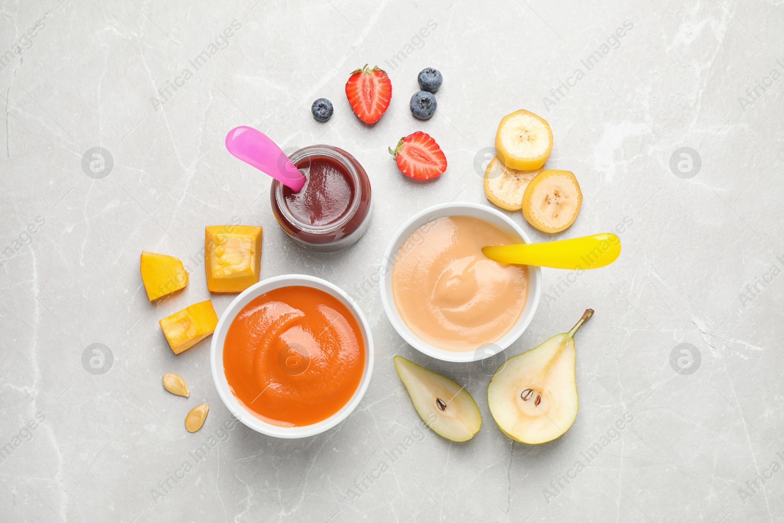 Photo of Healthy baby food and ingredients on grey table, flat lay